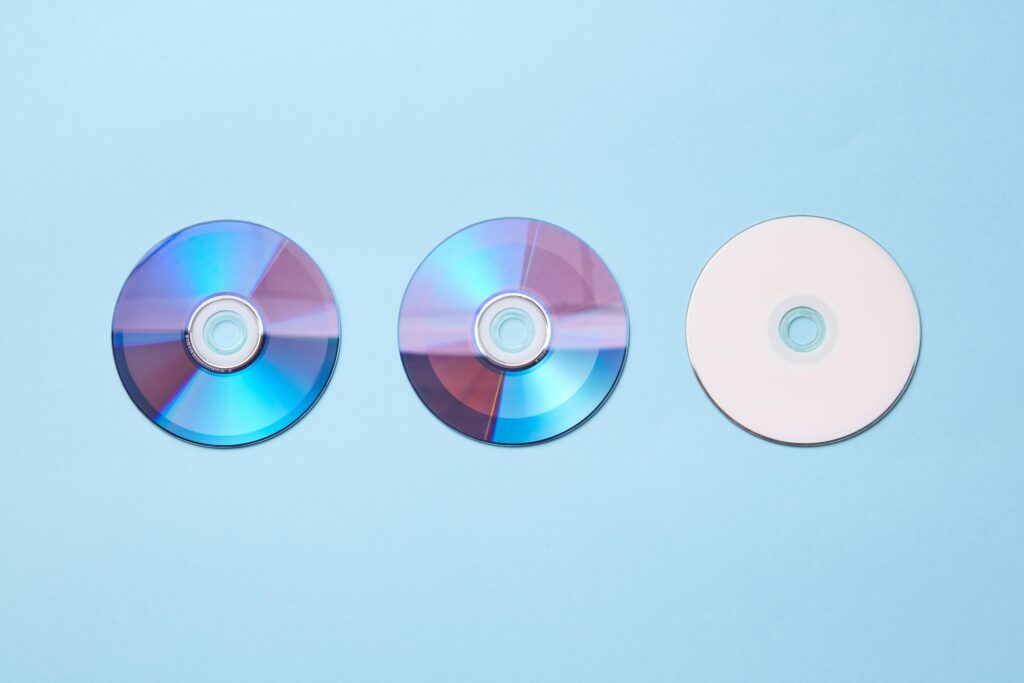 Compact disk on blue surface