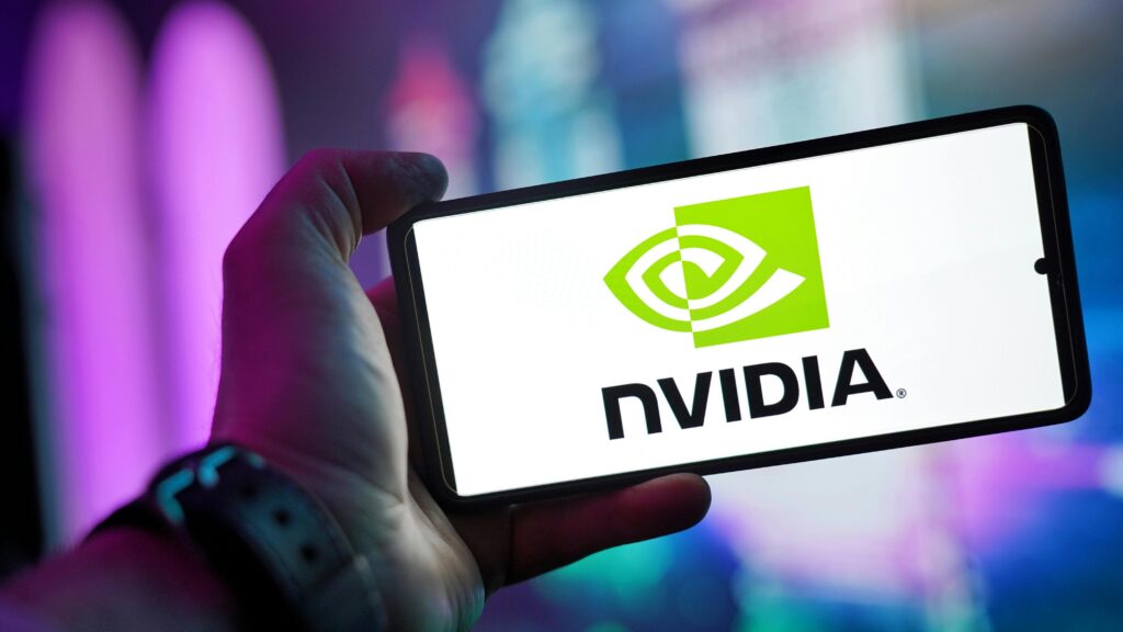 Person holding smartphone displaying nvidia logo